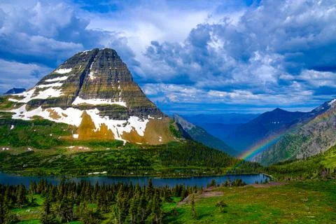Rainbnow after the storm at Bear Hat Mountain  Glacier National Park Stock Photos