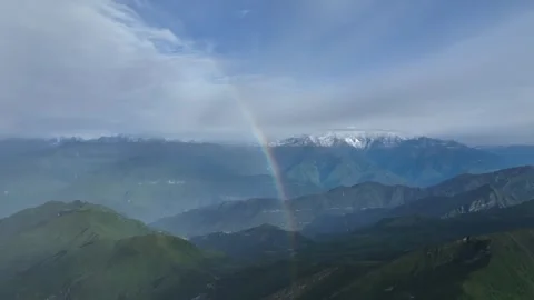 Rainbow Above Alpine Valleys And Snow Peaks in Sichuan, China Stock Footage 344034476