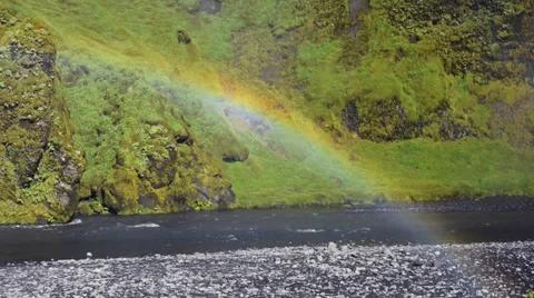 Rainbow above a river near the Skogafoss waterfall, Iceland Stock Footage 33747553