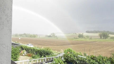 Rainbow above rural landscape Stock Footage 344275232