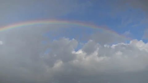 Rainbow after rain in thick clouds Stock Footage 138535150