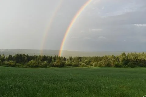 A rainbow after the storm Stock Photos