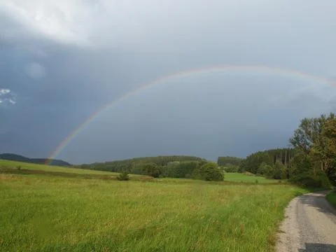 The rainbow after a thunderstorm Stock Photos