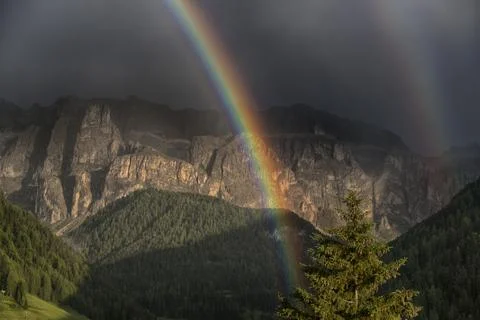 Rainbow after the thunderstorm at the sunset Stock Photos