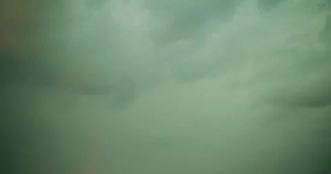 Rainbow Against Cloudy Sky Transitioning to Clear Weather Stock Footage 311272253