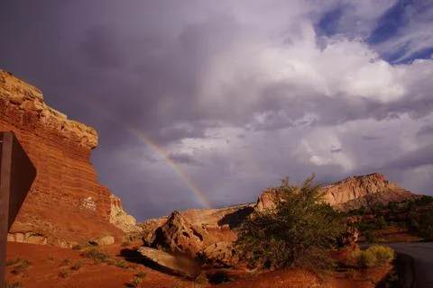 Rainbow and brief dramatic sunshine Stock Photos