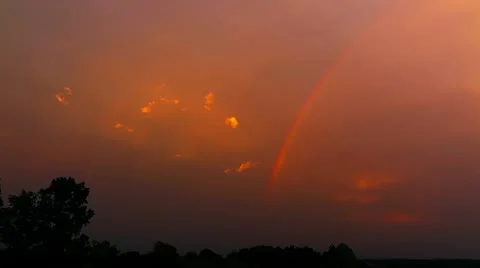 Rainbow and Clouds in Late Evening with Dynamic Color Stock Footage 12432903