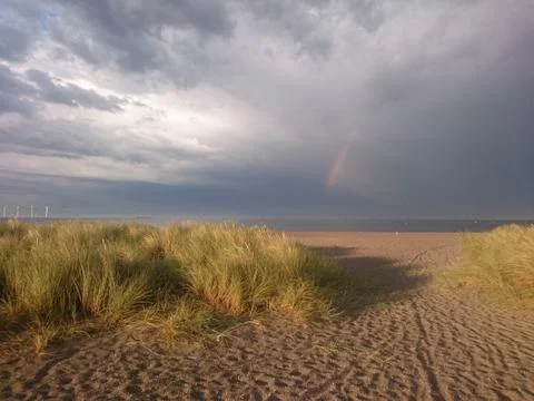 Rainbow and dramatic sky at the beach in Copenhagen - Amager Foto stock
