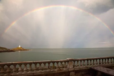 Rainbow and lighthouse Stock Photos