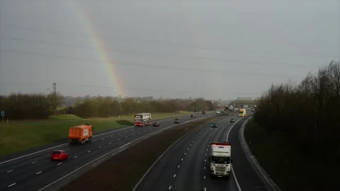 Rainbow and rain drops over A1/M motorway leeds yorkshire united kingdom Stock Footage 170819743