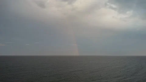 Rainbow and rain in sea Stock Footage 242452657