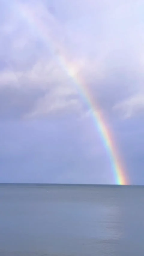 Rainbow and sea from a car window on a road in Northern Ireland. Video stock 260536313