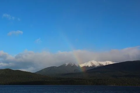 Rainbow and Snow-capped Mountains at Te Anau Stock Photos