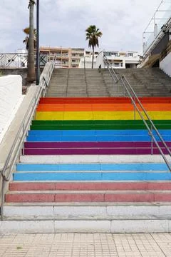 Rainbow and transgender flags on steps in tenerife Stock Photos