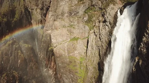 A rainbow and a waterfall in the bottom of a valley Stock Footage 124289501