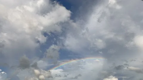 Rainbow appear n disappear over thunder rain storm cloud Stock Footage 154649273
