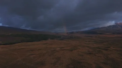 Rainbow Appearing Against Dark Stormy Sky Over Scenic Landscape Stock Footage 343420493