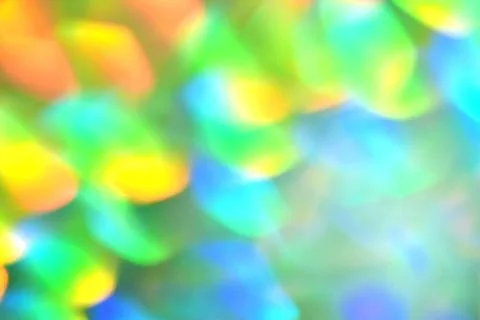 Rainbow background, blurred effect. Glowing holiday light circles are creat.. Stock Photos