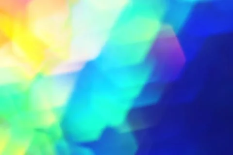 Rainbow background, blurred effect. Glowing holiday light circles are creat.. Stock Photos