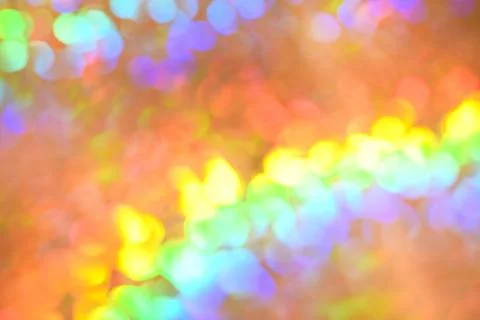Rainbow background, blurred effect. Glowing holiday light circles are creat.. Stock Photos