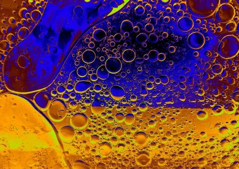Rainbow background with bubbles, texture of water and oil drops. Stock Illustration