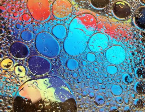 Rainbow background with bubbles, texture of water and oil drops. Stock Illustration