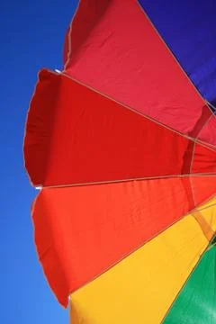 Rainbow beach umbrella Foto stock