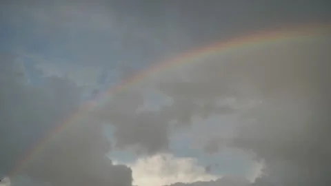 Rainbow with beautiful clouds after rain.background. the focus is not clear Stock Footage 156407097