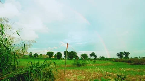 Rainbow in the beautiful open field Video stock 314780565