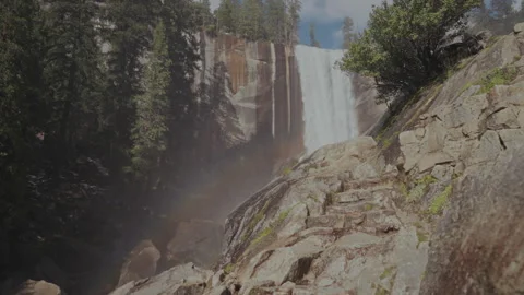 Rainbow below Vernal Fall from granite steps on Mist Trail Video stock 347986572