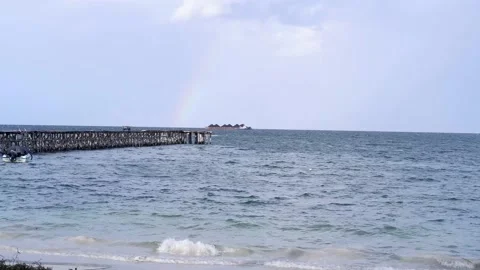 Rainbow beside the pier Stock Footage 223768880