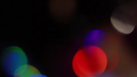 Rainbow blinking bokeh downwards in video Stock Footage 309581793