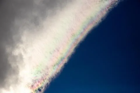 Rainbow in the blue sky with clouds Stock Photos