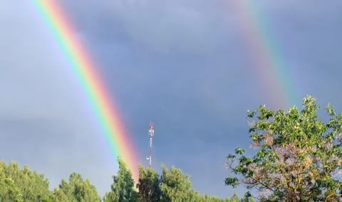 Rainbow on blue sky Stock Photos