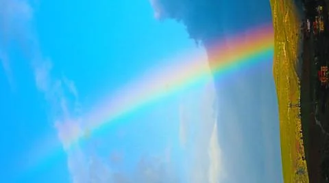 A Rainbow in a blue sky Stock Photos