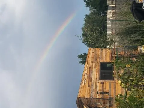 Rainbow in blue sky Stock Photos