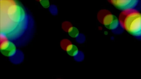 Rainbow bokeh lights drifting smoothly across dark background Stock Footage 337227506