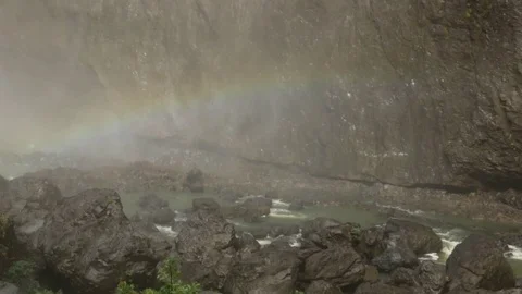 Rainbow at the bottom of a waterfall Video stock 71230691