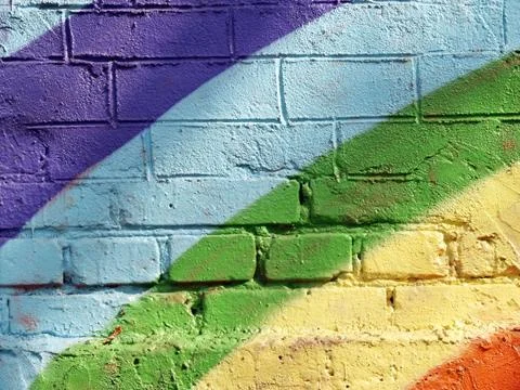 Rainbow brick wall Stock Photos