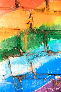 Rainbow on a brick wall. Red, orange, yellow, green, blue, purple bright colors Stock Photos