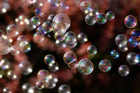 The rainbow bubbles from the bubble blower Stock Photos