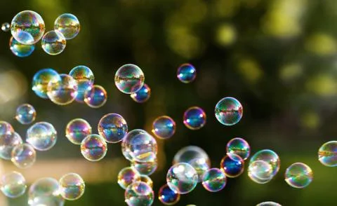 The rainbow bubbles from the bubble blower Stock Photos