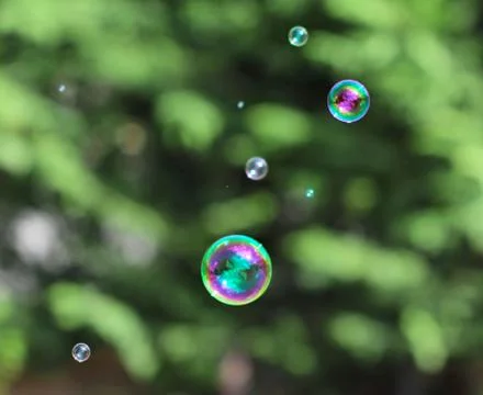 The rainbow bubbles from the bubble blower Stock Photos