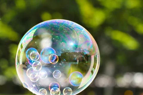 The rainbow bubbles from the bubble blower Stock Photos