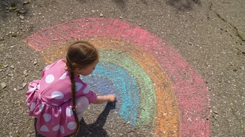 Rainbow child hand drawing chalk asphalt, child kid childhood dream, little Stock Footage 276869293