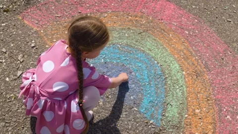 Rainbow child hand drawing chalk asphalt, child kid childhood dream, little Stock Footage 294668296