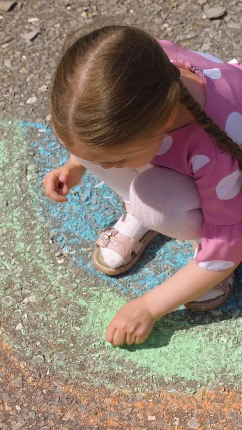 Rainbow child hand drawing chalk asphalt, child kid childhood dream, little Stock Footage 299738328