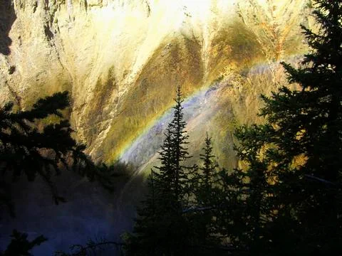 A rainbow at the cliff in the mountains Stock Photos
