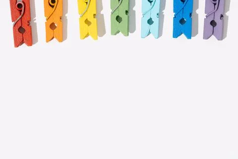 Rainbow clothespins text space Stock Photos