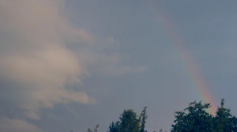 Rainbow, cloud looming over the rainbow Stock Footage 41387149